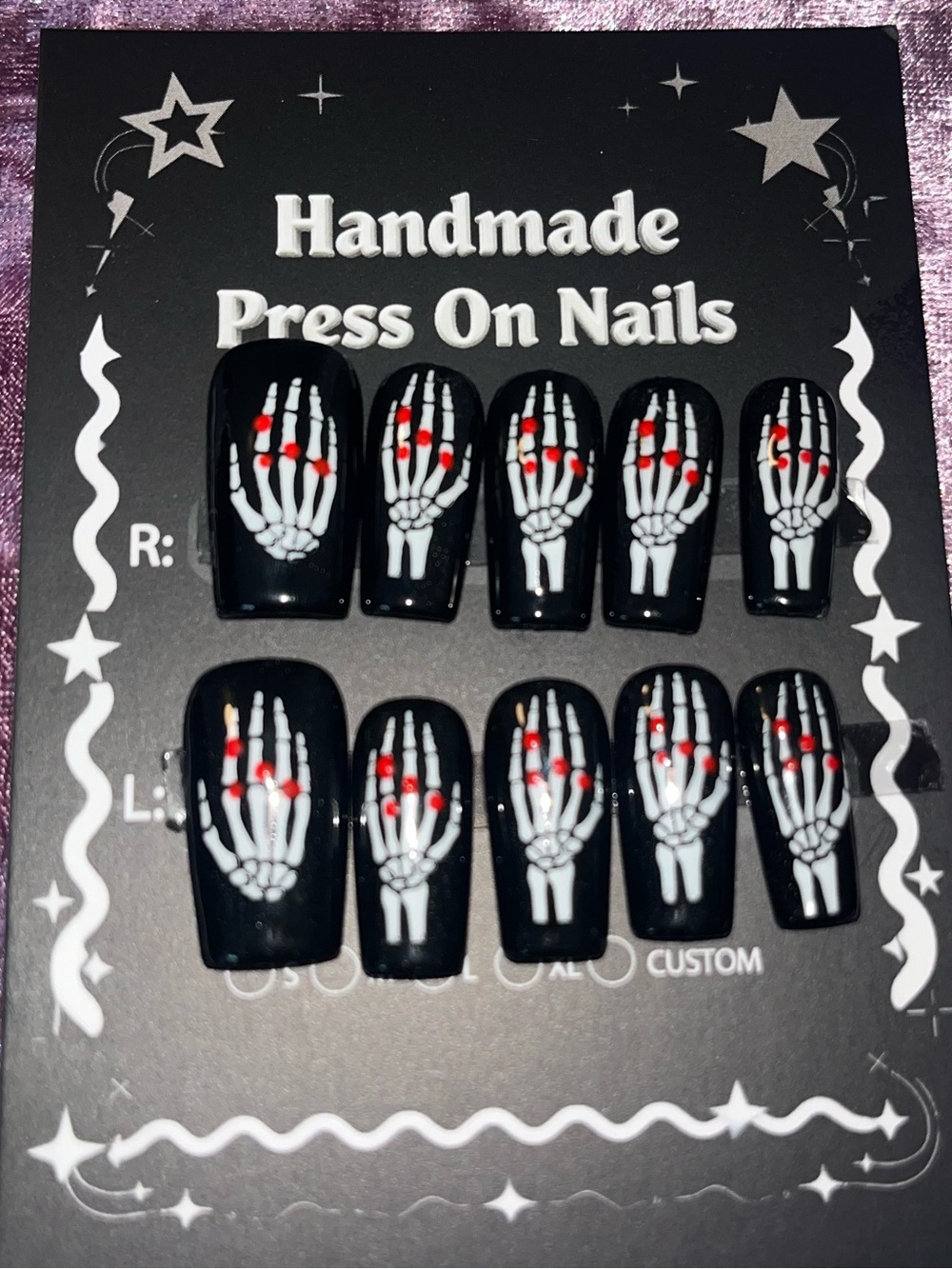 Handmade Black Press-On Nails with White Skeleton Hand Design